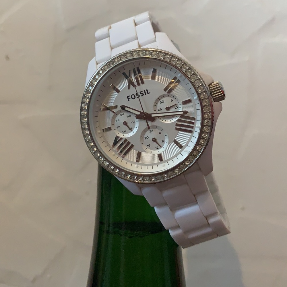 White Fossil watch with “diamonds” around face